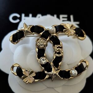 CHANEL Black and Gold Embellished Brooch